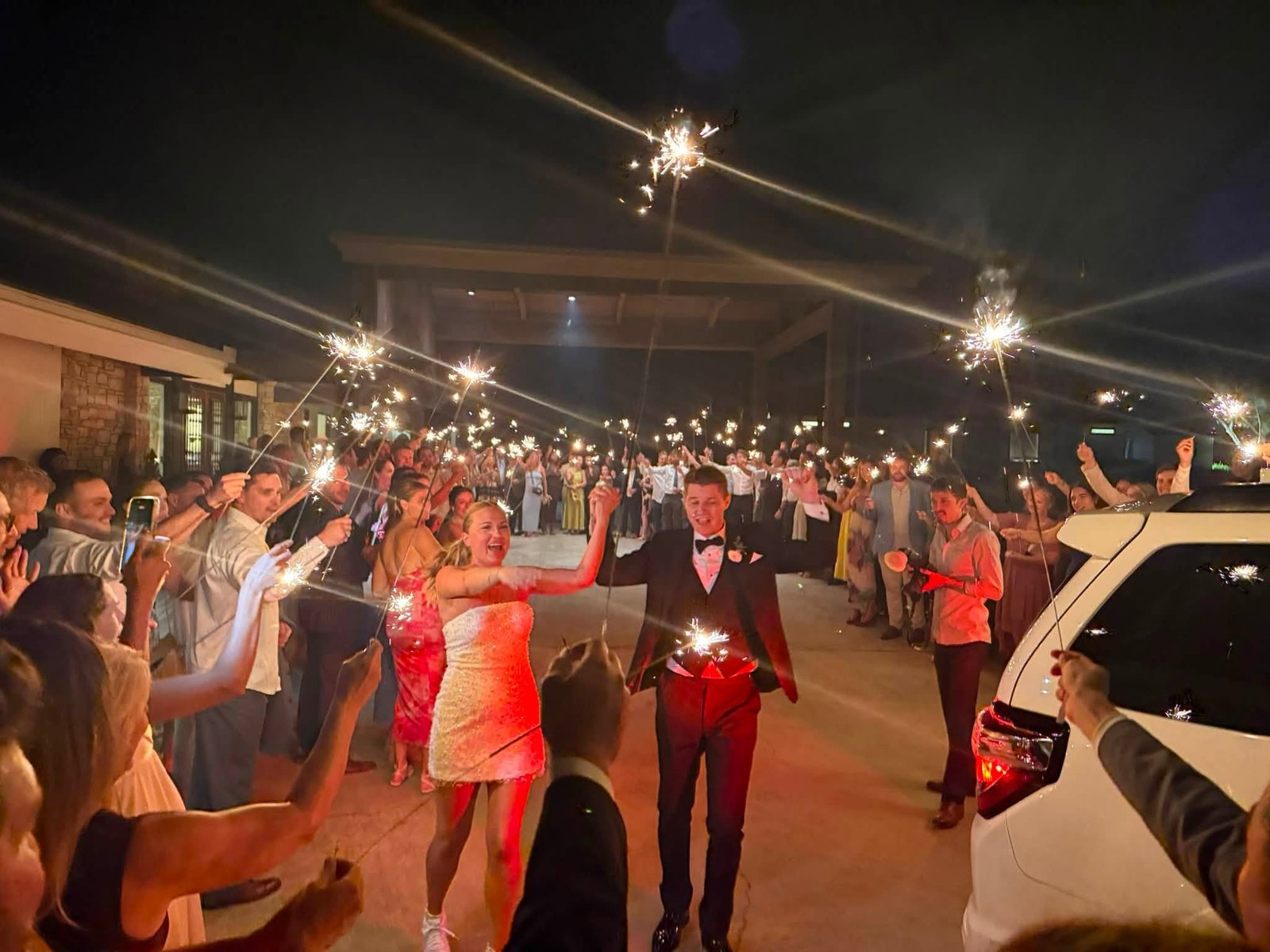 Newlyweds during a sparkler exit