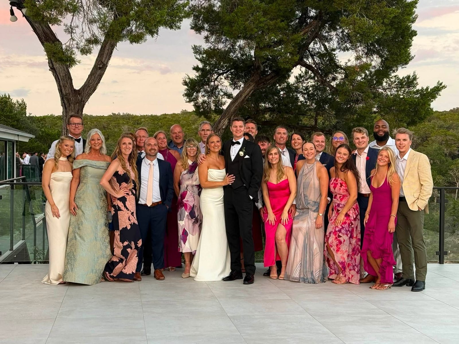 Wedding couple surrounded by family and friends